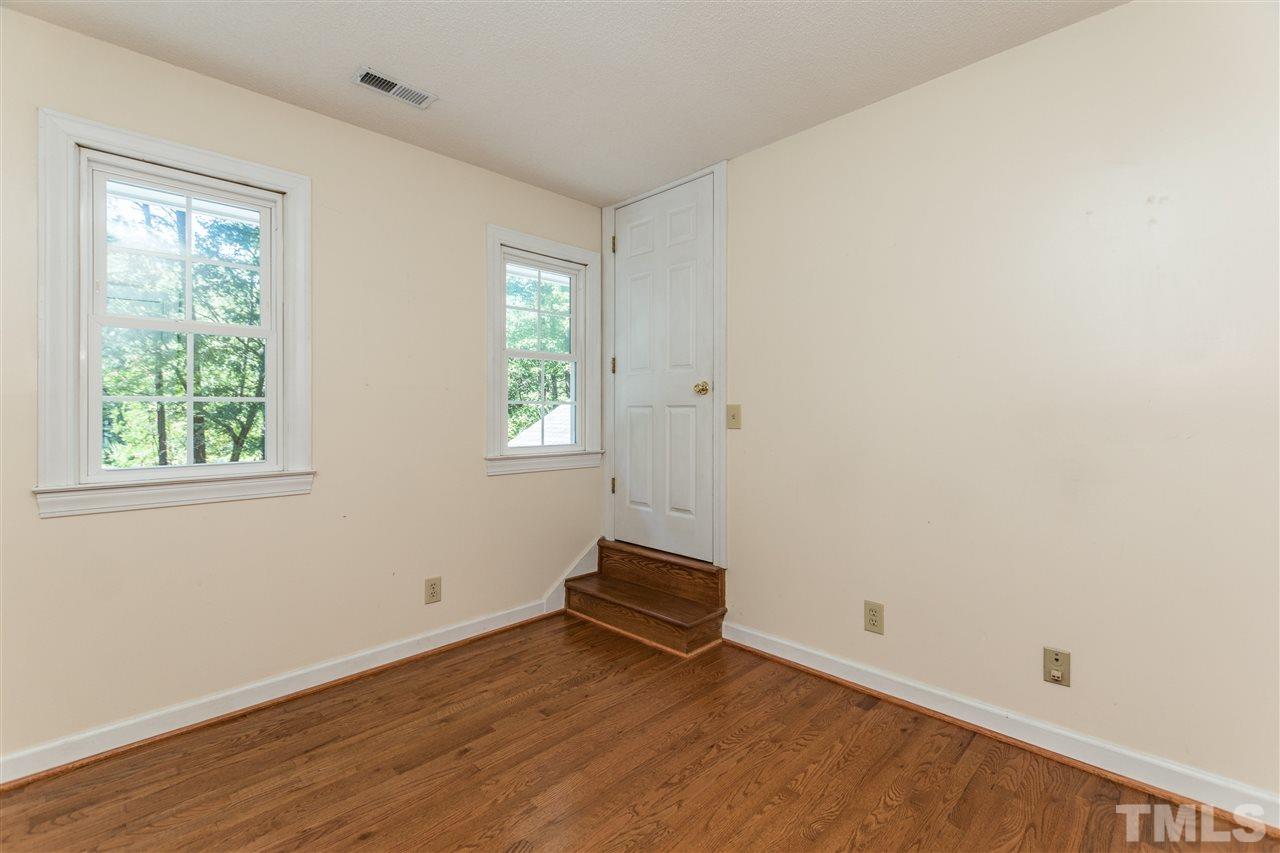 5606 Red Coach Road Durham, NC 27712 - Photo 21 of 25 an empty room with wooden floor and window