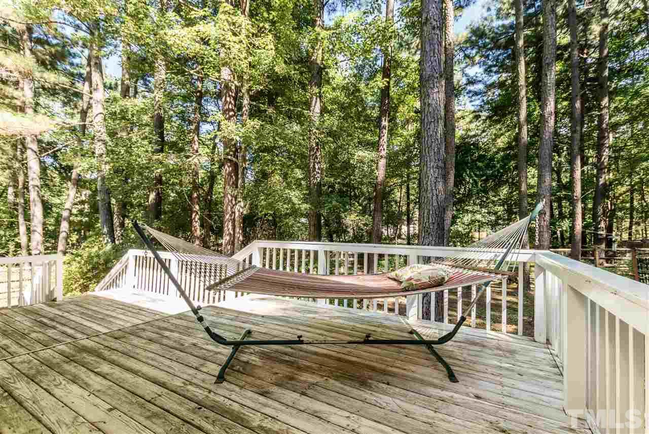 5606 Red Coach Road Durham, NC 27712 - Photo 22 of 25 a view of balcony with wooden floor and outdoor seating