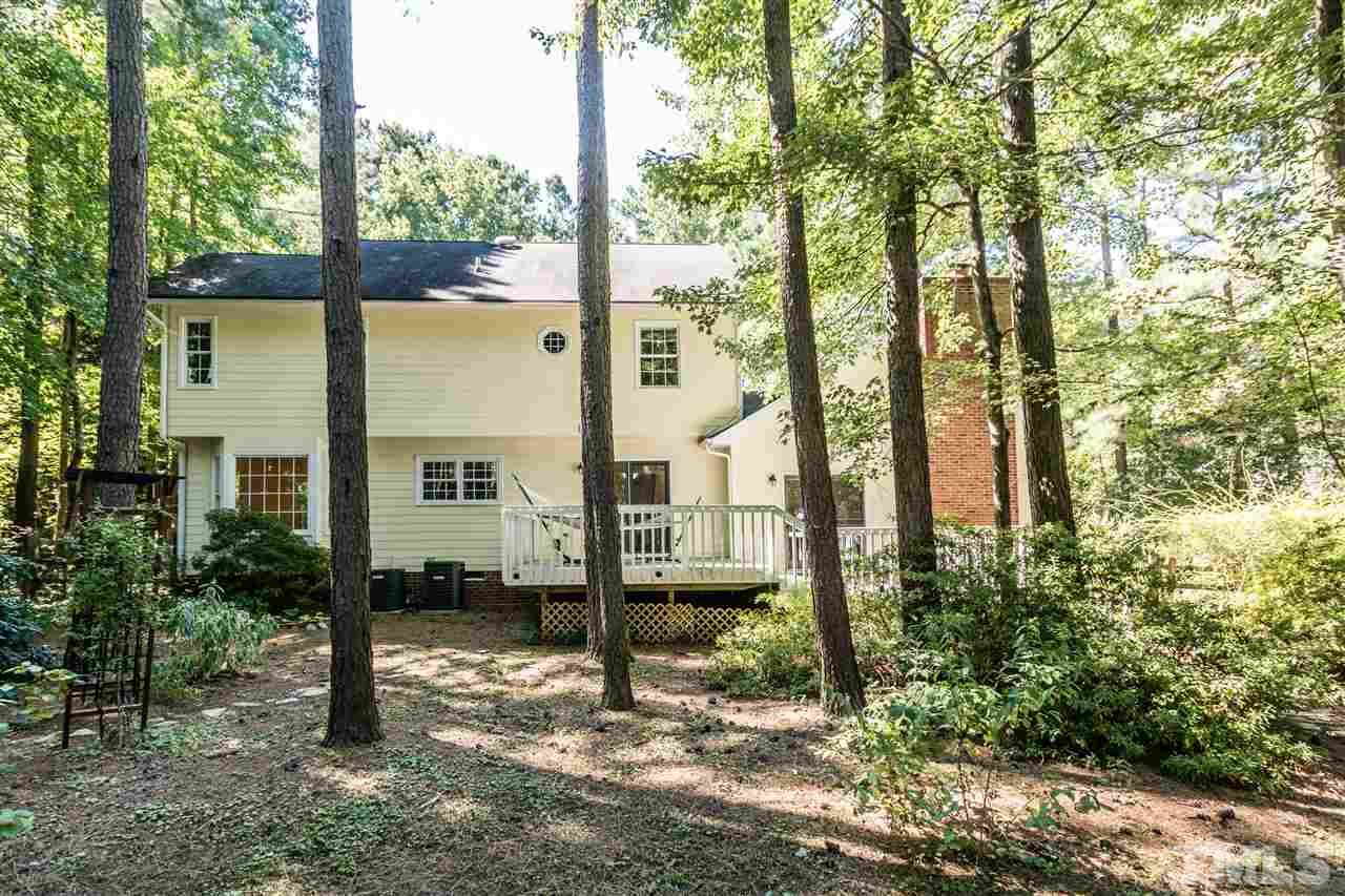 5606 Red Coach Road Durham, NC 27712 - Photo 24 of 25 a view of a garden with large trees