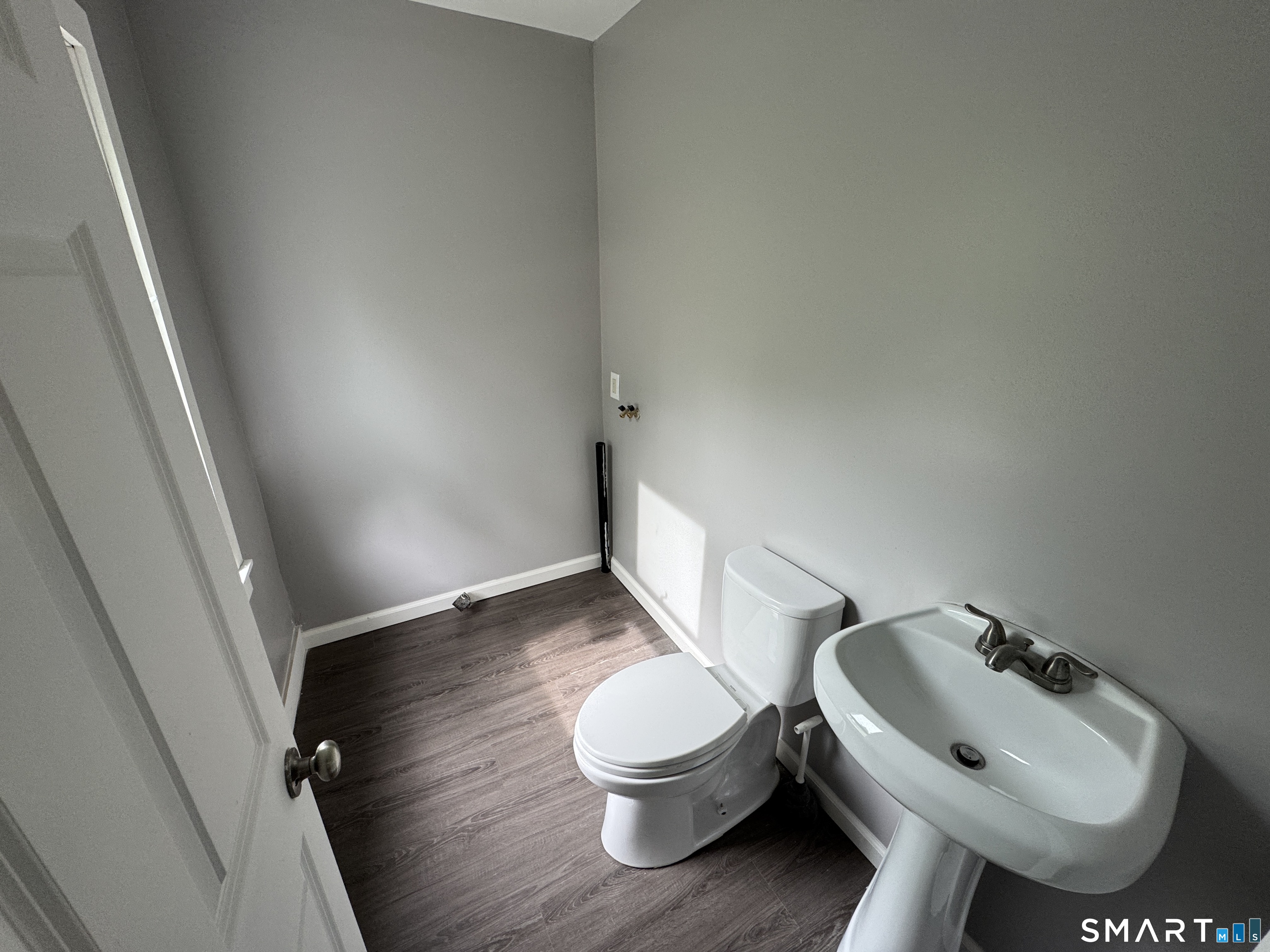 10 Center Street Windsor Locks, CT 06096 - Photo 5 of 25 a bathroom with a sink toilet and a mirror