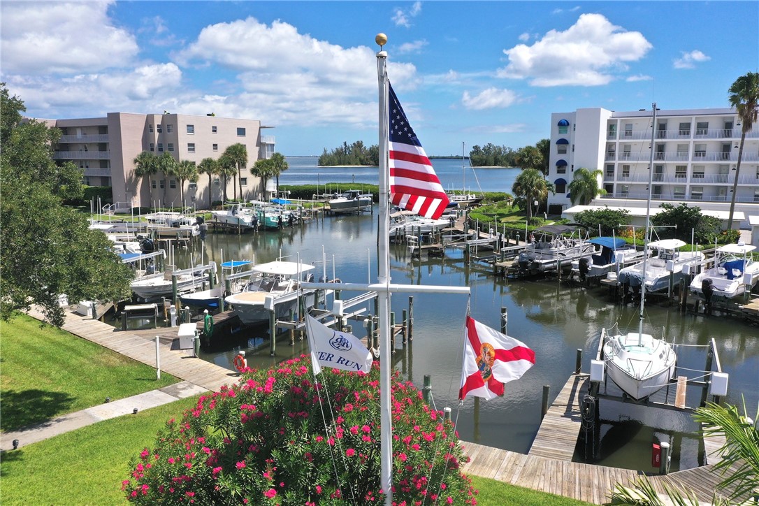0 River Run Drive Sebastian, FL 32958 - Photo 3 of 5 a view of a lake with chairs and a table