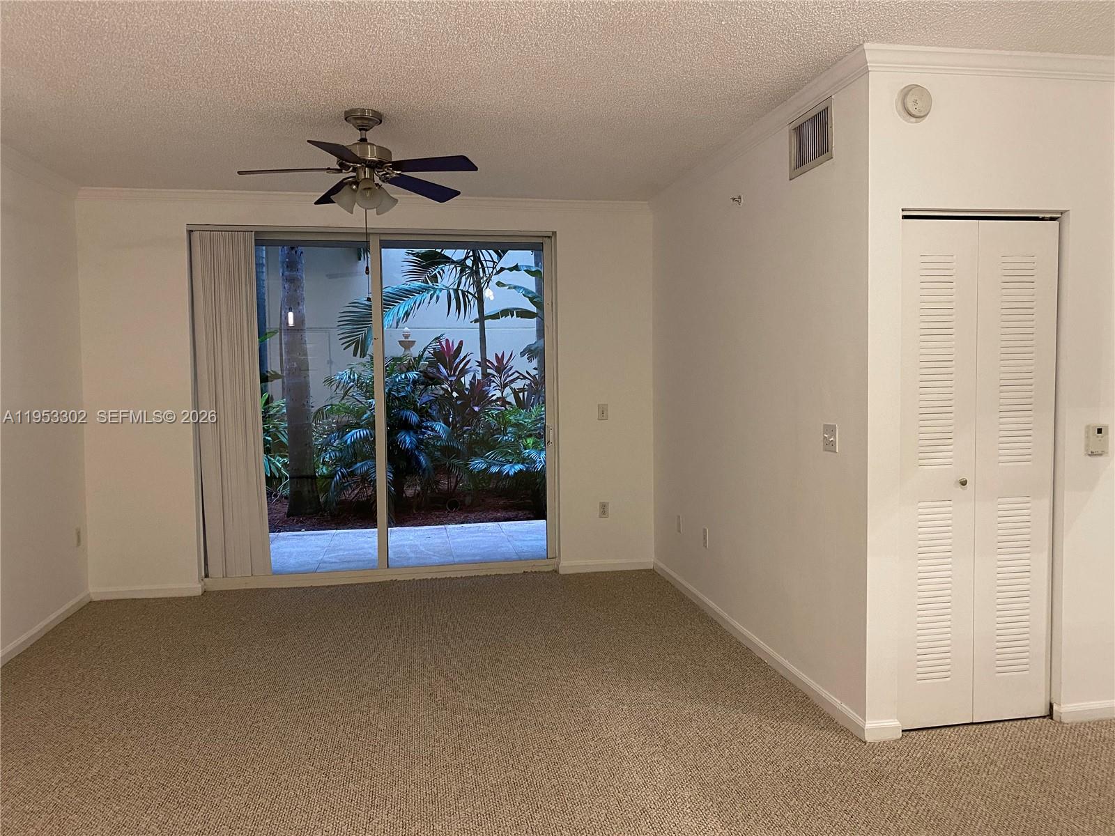 17150 North Bay Road, Unit 2119 Sunny Isles Beach, FL 33160 - Photo 11 of 41 a view of a hallway with a chandelier