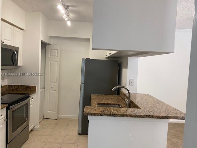 17150 North Bay Road, Unit 2119 Sunny Isles Beach, FL 33160 - Photo 3 of 41 a close view of a sink and dishwasher in kitchen