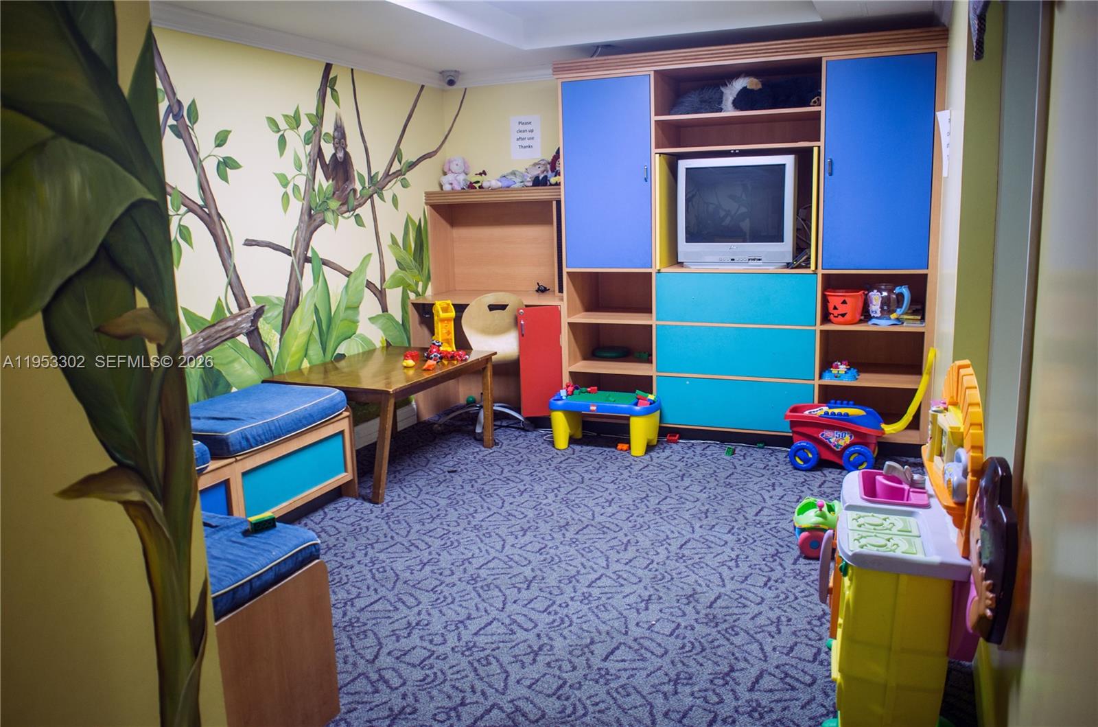 17150 North Bay Road, Unit 2119 Sunny Isles Beach, FL 33160 - Photo 37 of 41 a living room with blue painted walls