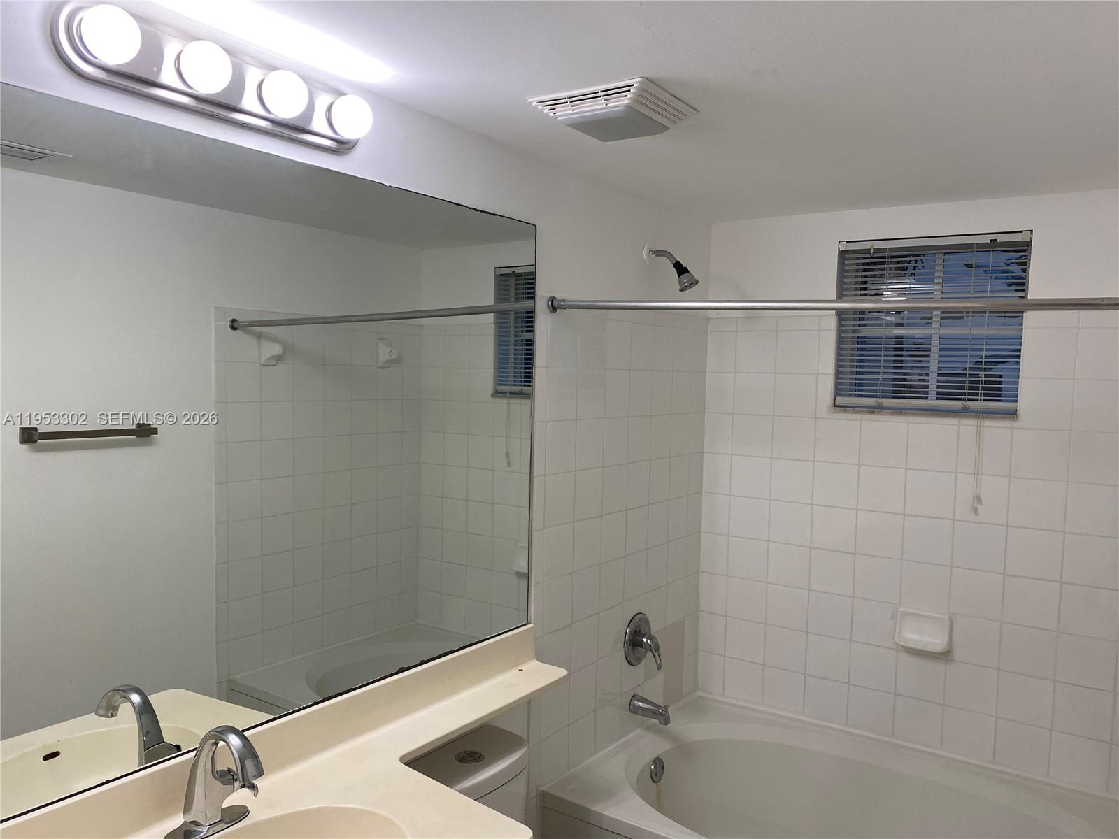 17150 North Bay Road, Unit 2119 Sunny Isles Beach, FL 33160 - Photo 9 of 41 a bathroom with a sink a toilet and shower