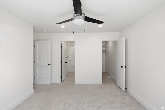 730 West 500 North Smithfield, UT 84335 - Photo 21 of 46 Spacious room featuring light-colored carpet flooring, a contemporary ceiling fan with integrated lighting, recessed ceiling lights, and white trim