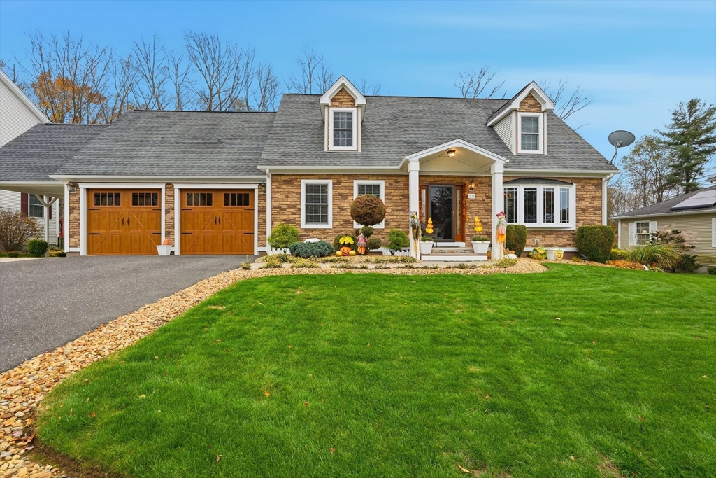 a front view of a house with garden