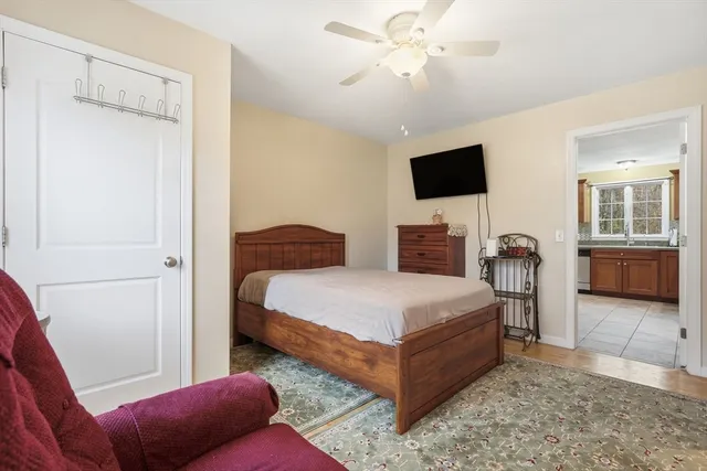 a bedroom with a bed and a television