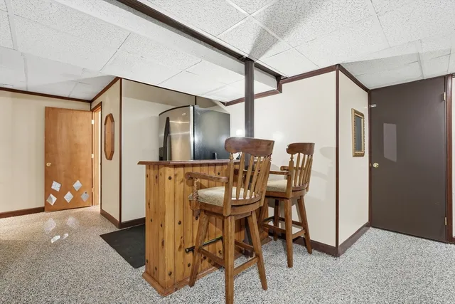 a dining room with furniture and entryway