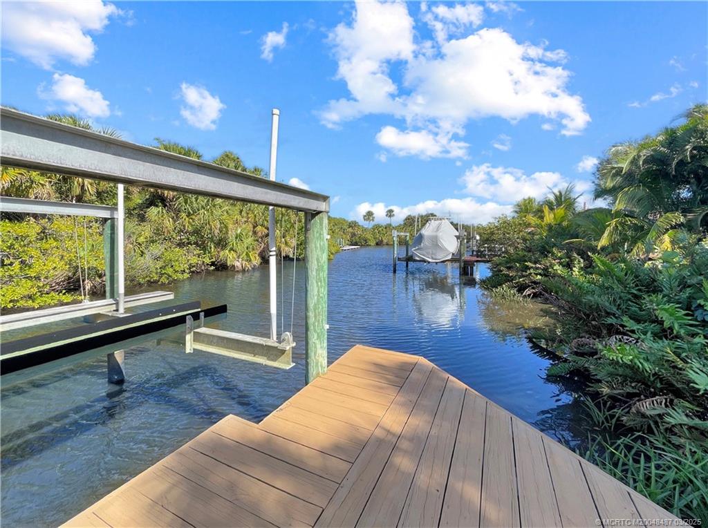 443 Southwest Lost River Road Stuart, FL 34997 - Photo 4 of 34 View from dock down canal