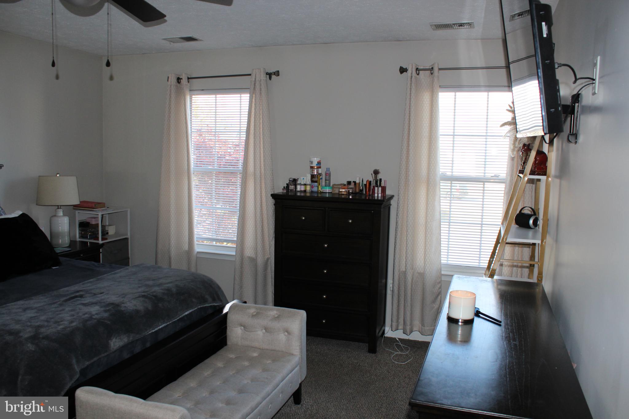 107 Fancy Court Stephens City, VA 22655 - Photo 13 of 36 a bedroom with a bed and wooden floor