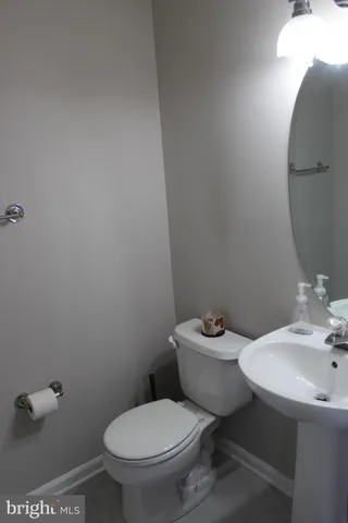 a view of a storage and utility room with washer and dryer