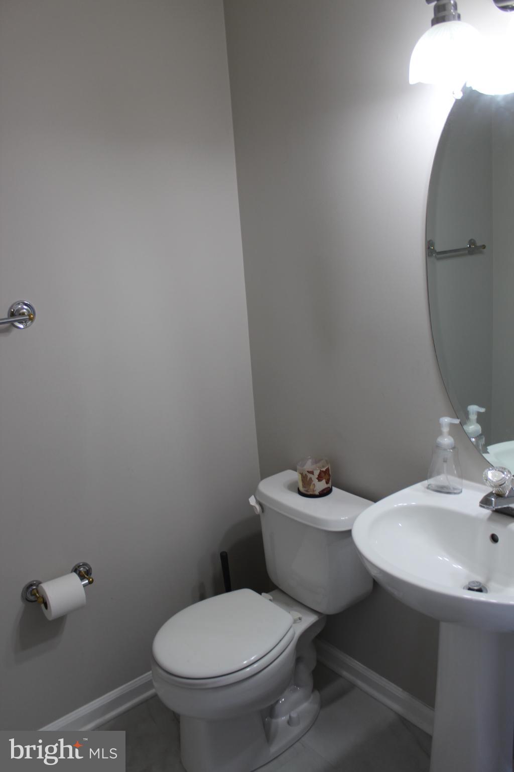 107 Fancy Court Stephens City, VA 22655 - Photo 26 of 36 a white toilet sitting next to a bathroom sink