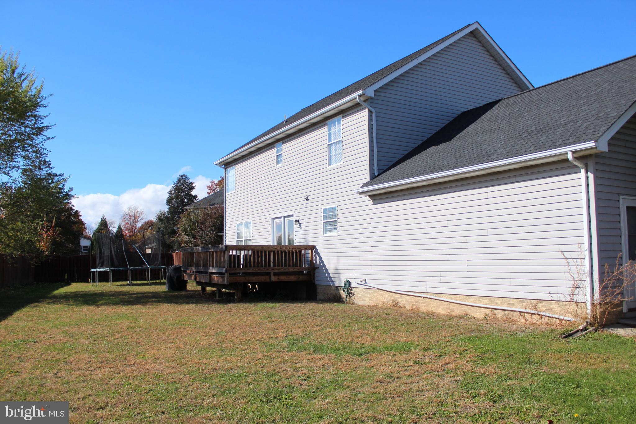 107 Fancy Court Stephens City, VA 22655 - Photo 29 of 36 a view of house with backyard and trees in the background