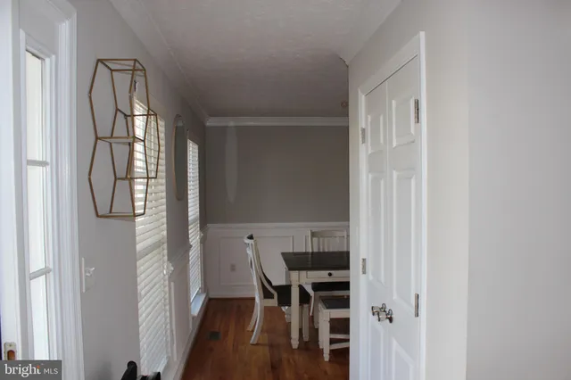 a view of a livingroom with furniture and a window