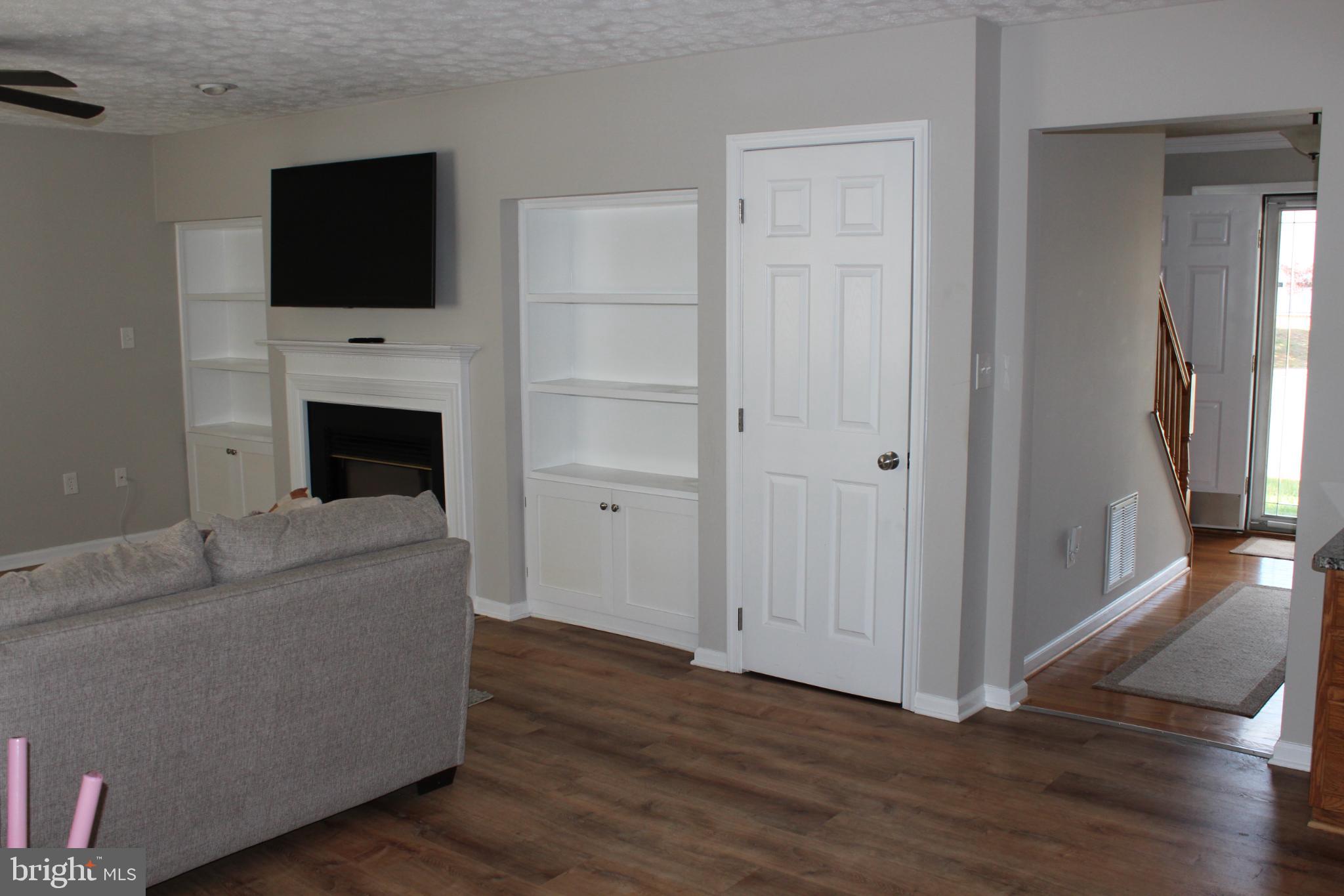 107 Fancy Court Stephens City, VA 22655 - Photo 8 of 36 a living room with furniture and a flat screen tv