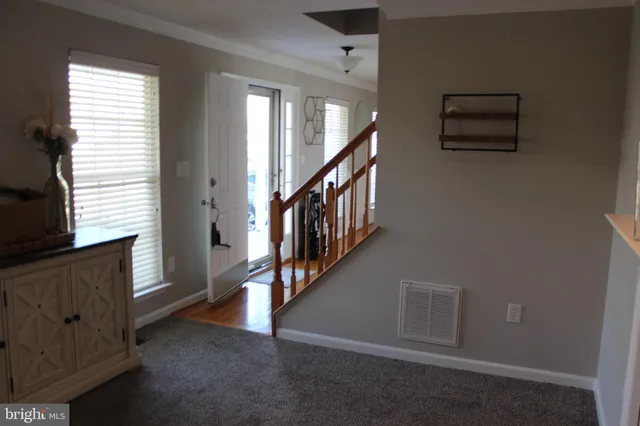 a view of an entryway with stairs