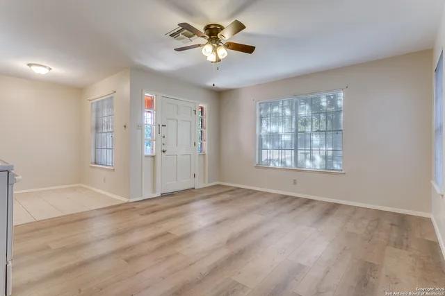 a kitchen with stainless steel appliances granite countertop a sink and a stove