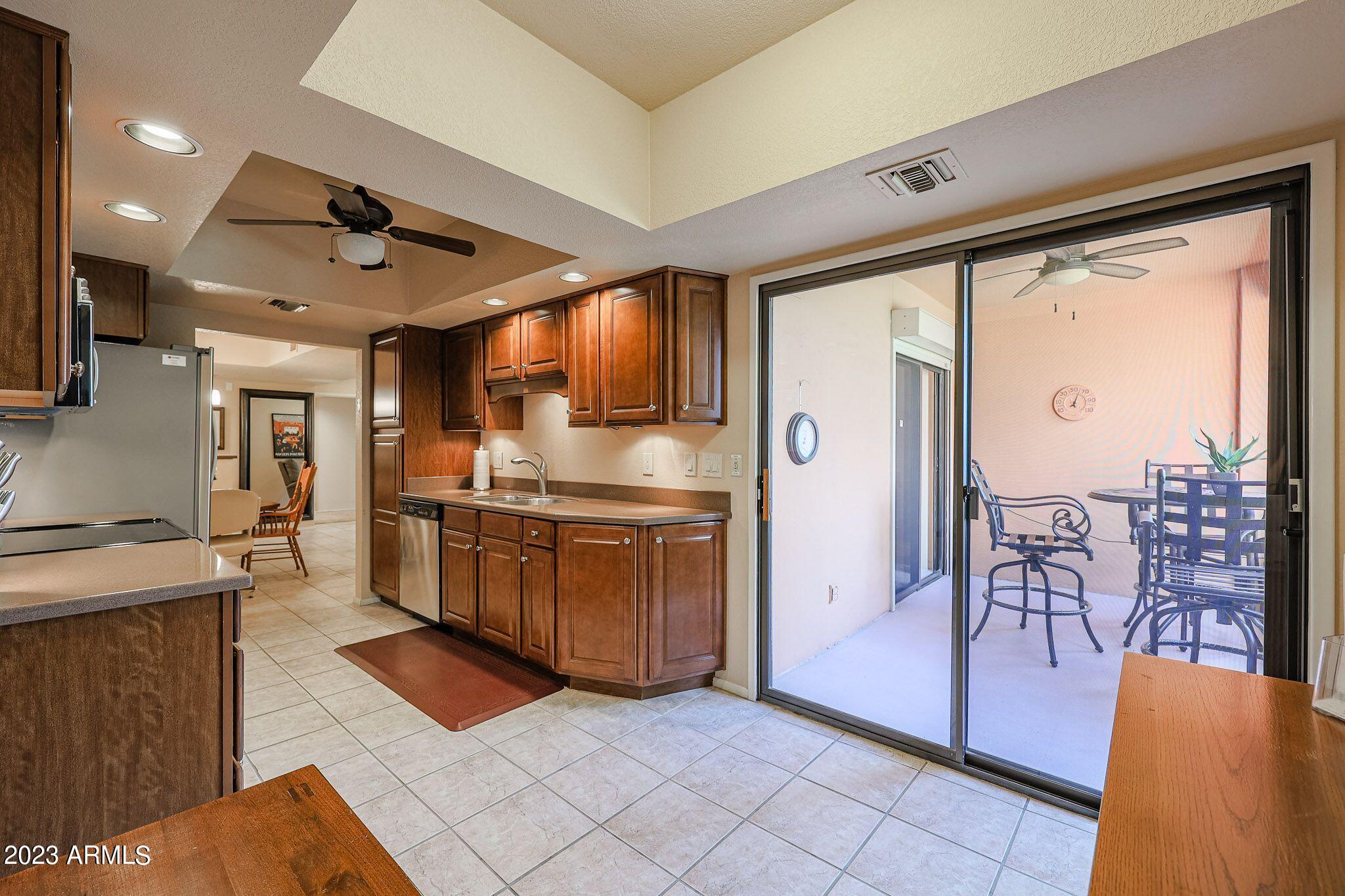 4303 East Cactus Road, Unit 431 Phoenix, AZ 85032 - Photo 18 of 49 9 431-VIEW OF KITCHEN & BALCONY
