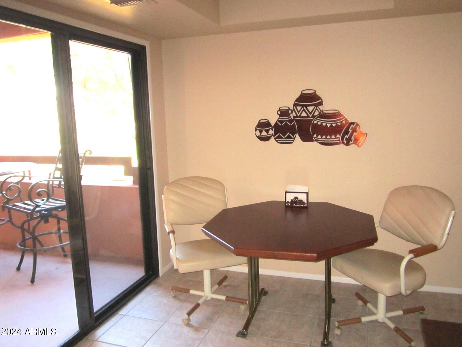 4303 East Cactus Road, Unit 431 Phoenix, AZ 85032 - Photo 19 of 49 9 431 A EATI IN KITCHEN