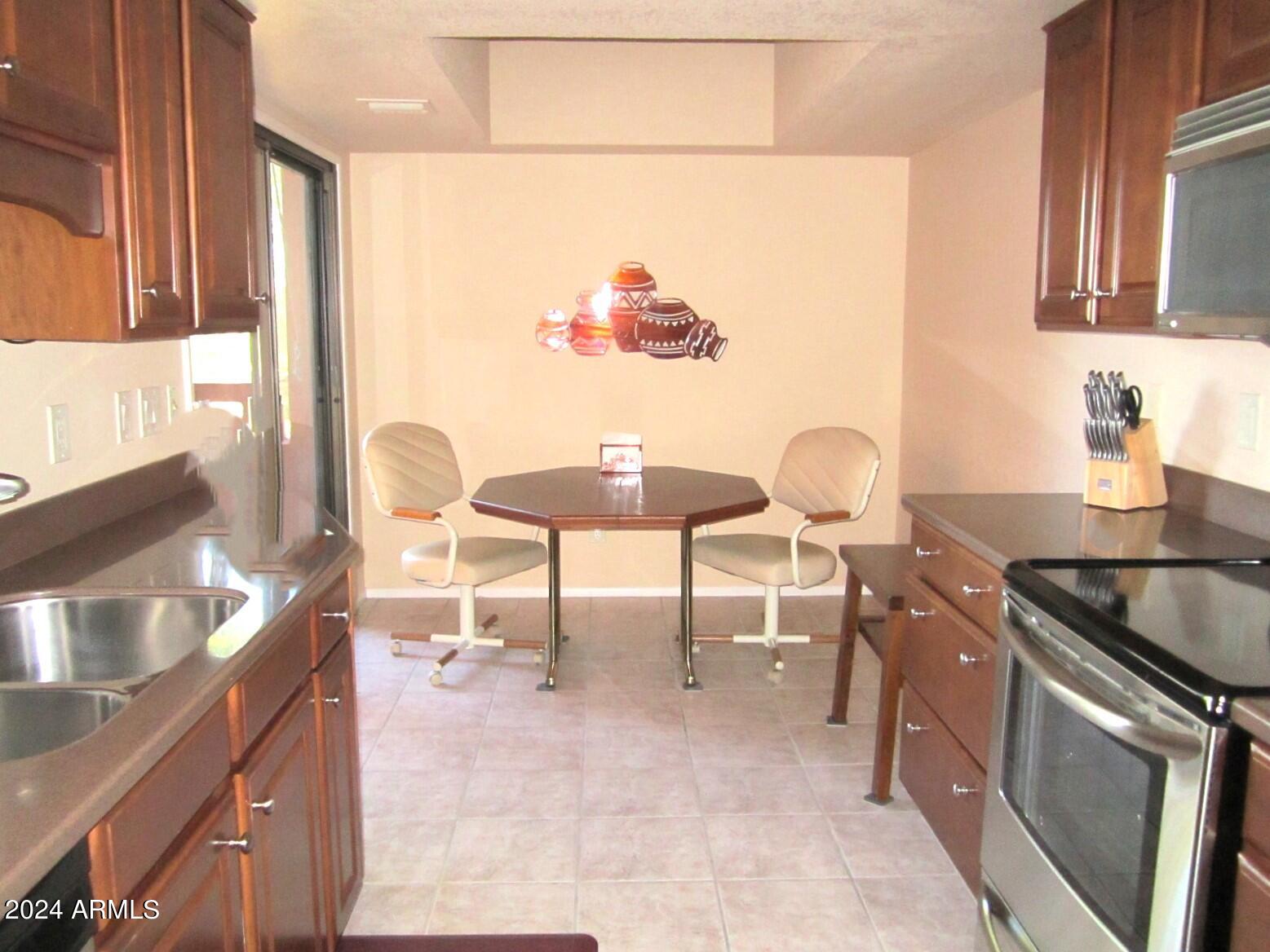 4303 East Cactus Road, Unit 431 Phoenix, AZ 85032 - Photo 20 of 49 9 431 A LIGHT FILLED KITCHEN