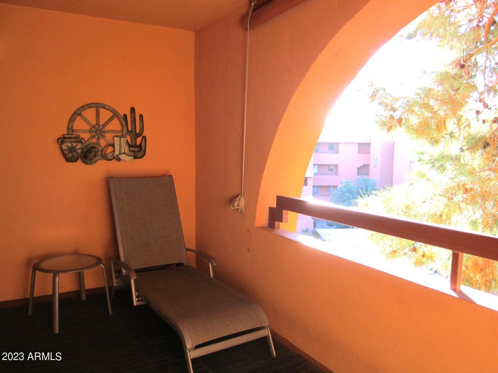 4303 East Cactus Road, Unit 431 Phoenix, AZ 85032 - Photo 31 of 49 9 431 LARGE BALCONY WITH PINES