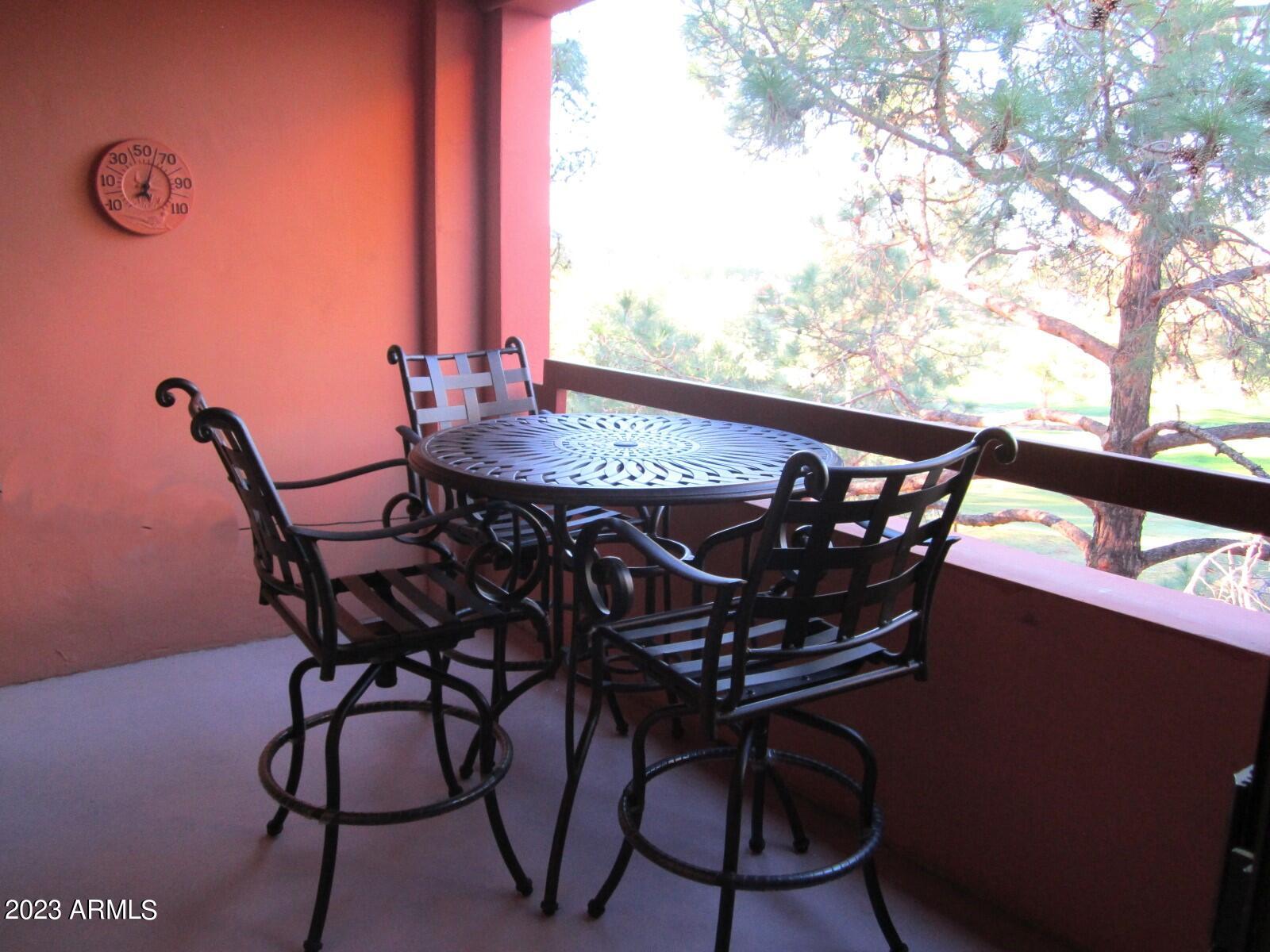 4303 East Cactus Road, Unit 431 Phoenix, AZ 85032 - Photo 41 of 49 9 431 SEATING WITH VIEW OF GOLF COURSE B