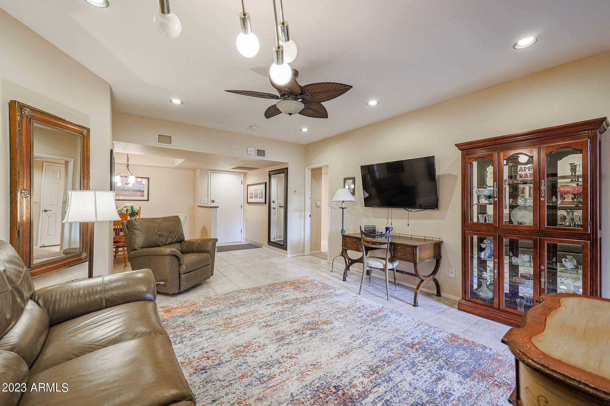 4303 East Cactus Road, Unit 431 Phoenix, AZ 85032 - Photo 6 of 49 9 431-COMFORTABLE LIVING ROOM