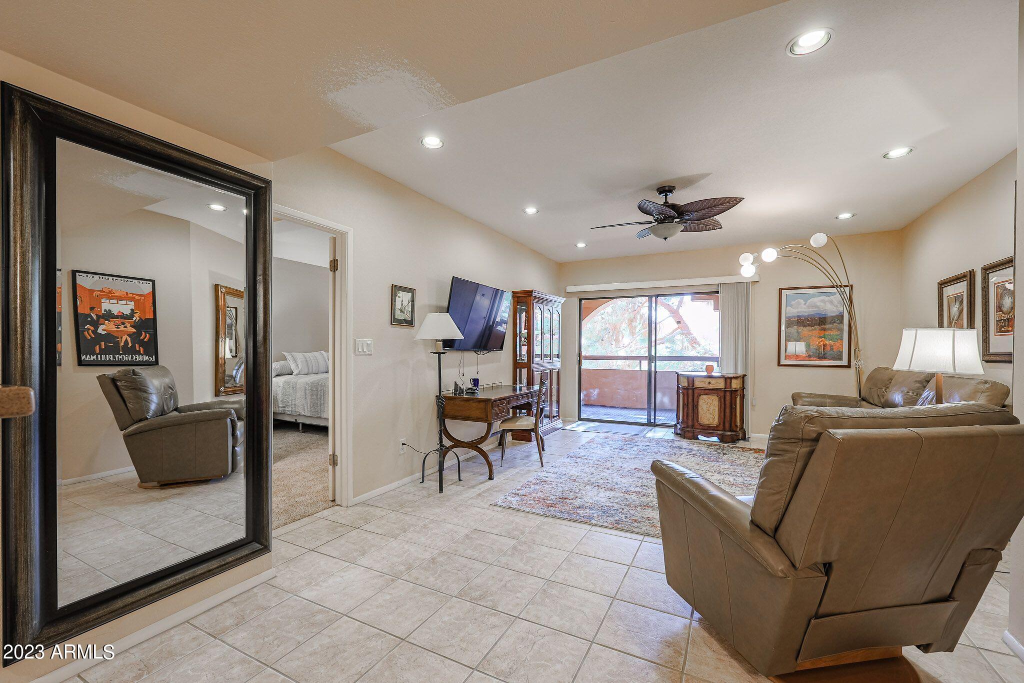 4303 East Cactus Road, Unit 431 Phoenix, AZ 85032 - Photo 9 of 49 9 431-LIVING ROOM TO BEDROOM