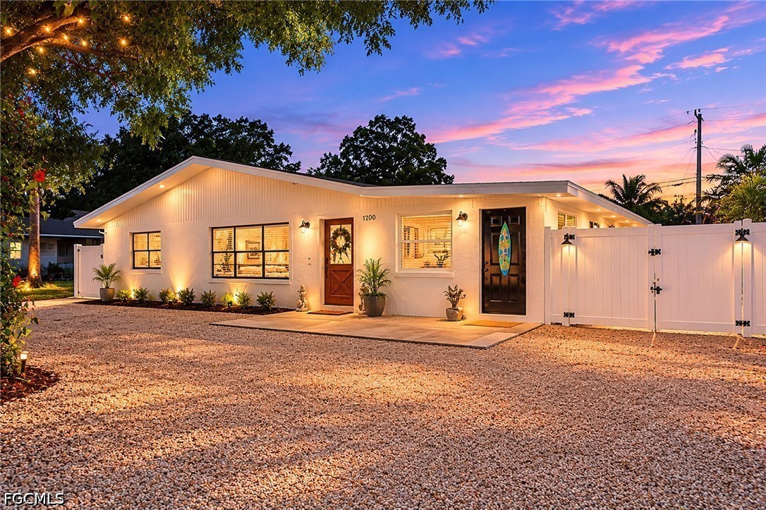 1200 Patterson Road Cape Coral, FL 33909 - Photo 1 of 42 a front view of a house with a yard