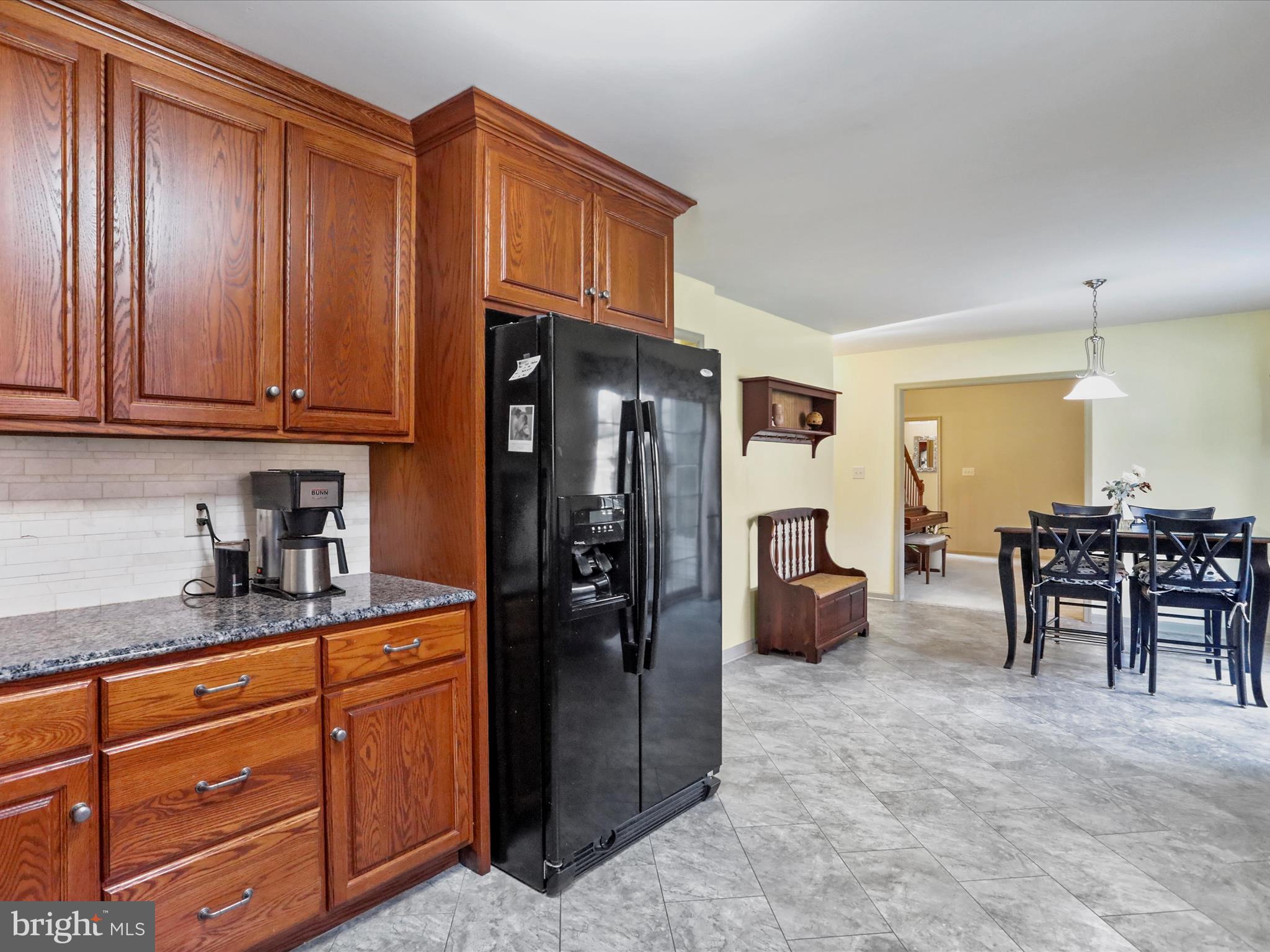 8297 Stottlemyer Road Waynesboro, PA 17268 - Photo 12 of 51 a kitchen with granite countertop a refrigerator and cabinets