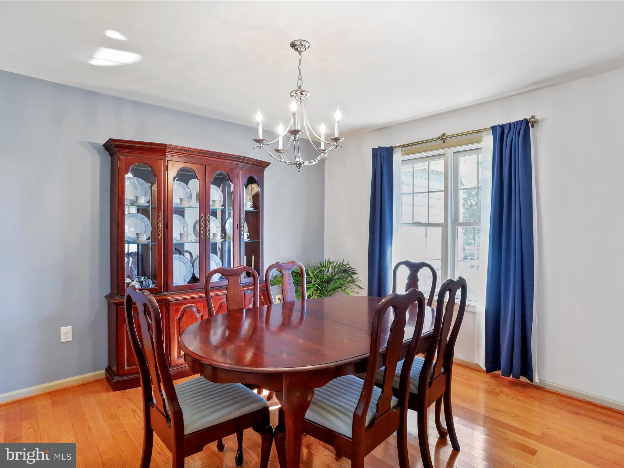 8297 Stottlemyer Road Waynesboro, PA 17268 - Photo 16 of 51 a view of a dining room with furniture window and wooden floor