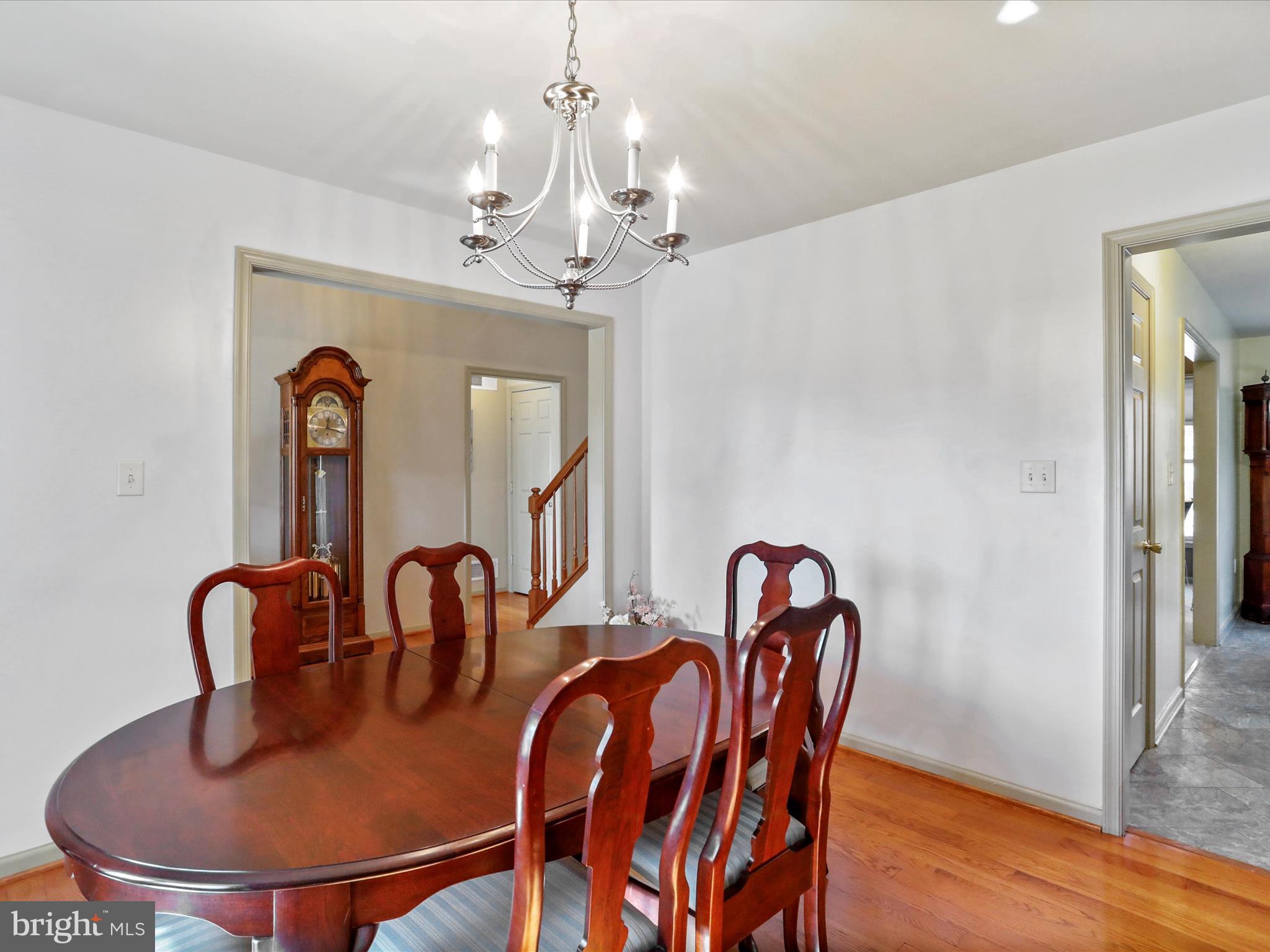 8297 Stottlemyer Road Waynesboro, PA 17268 - Photo 17 of 51 a dining room with furniture a chandelier and wooden floor
