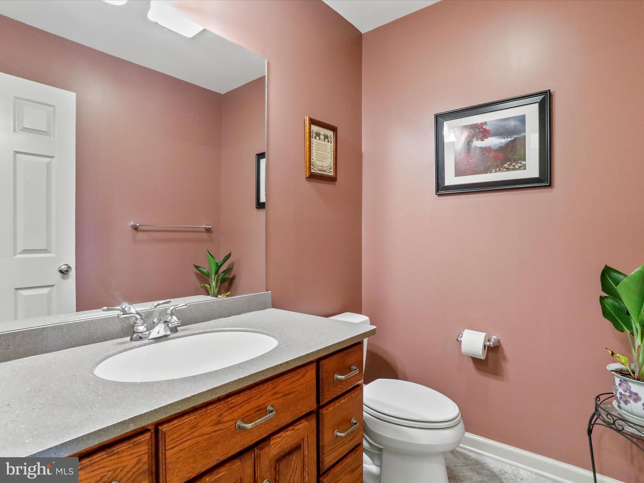 8297 Stottlemyer Road Waynesboro, PA 17268 - Photo 18 of 51 a bathroom with a granite countertop sink and a mirror with toilet