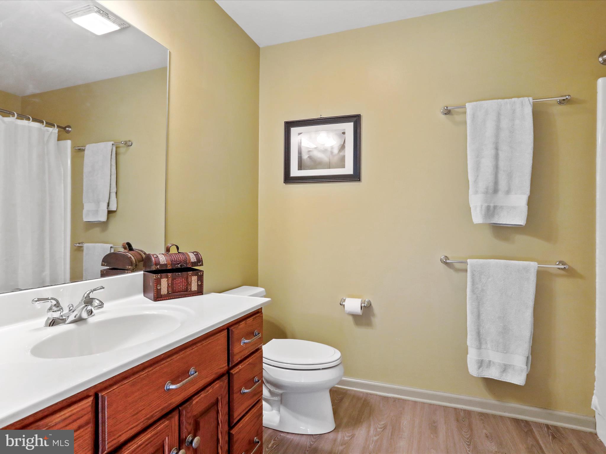 8297 Stottlemyer Road Waynesboro, PA 17268 - Photo 22 of 51 a bathroom with a sink a toilet and mirror