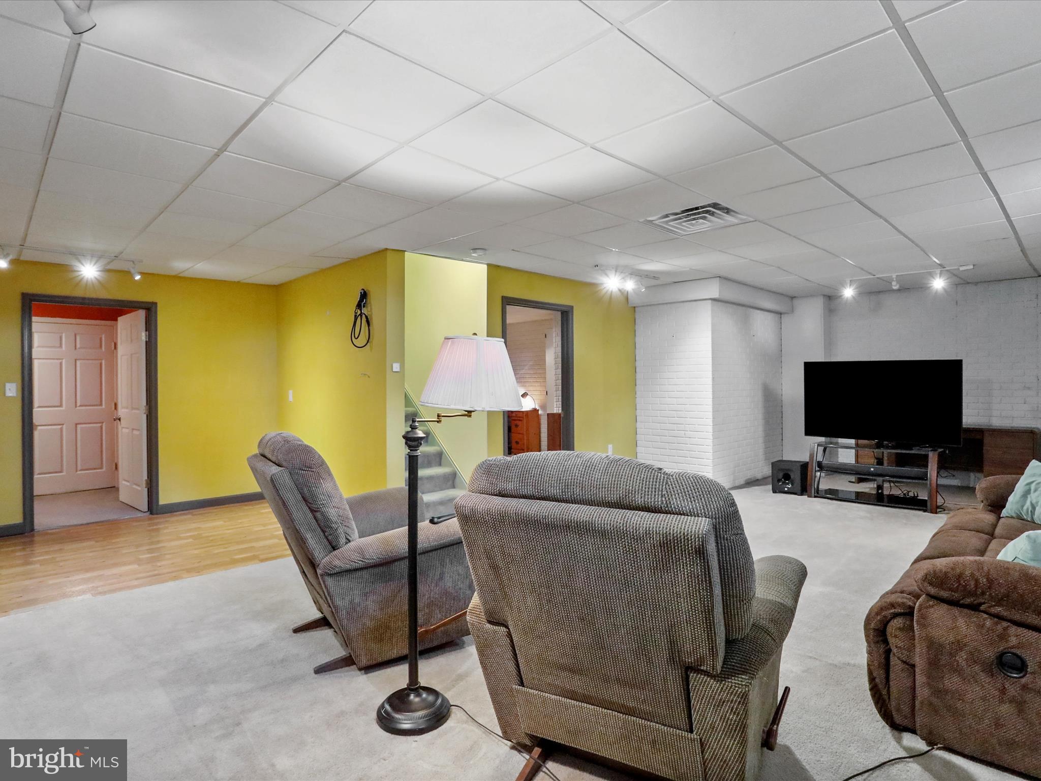 8297 Stottlemyer Road Waynesboro, PA 17268 - Photo 31 of 51 a living room with furniture and a flat screen tv