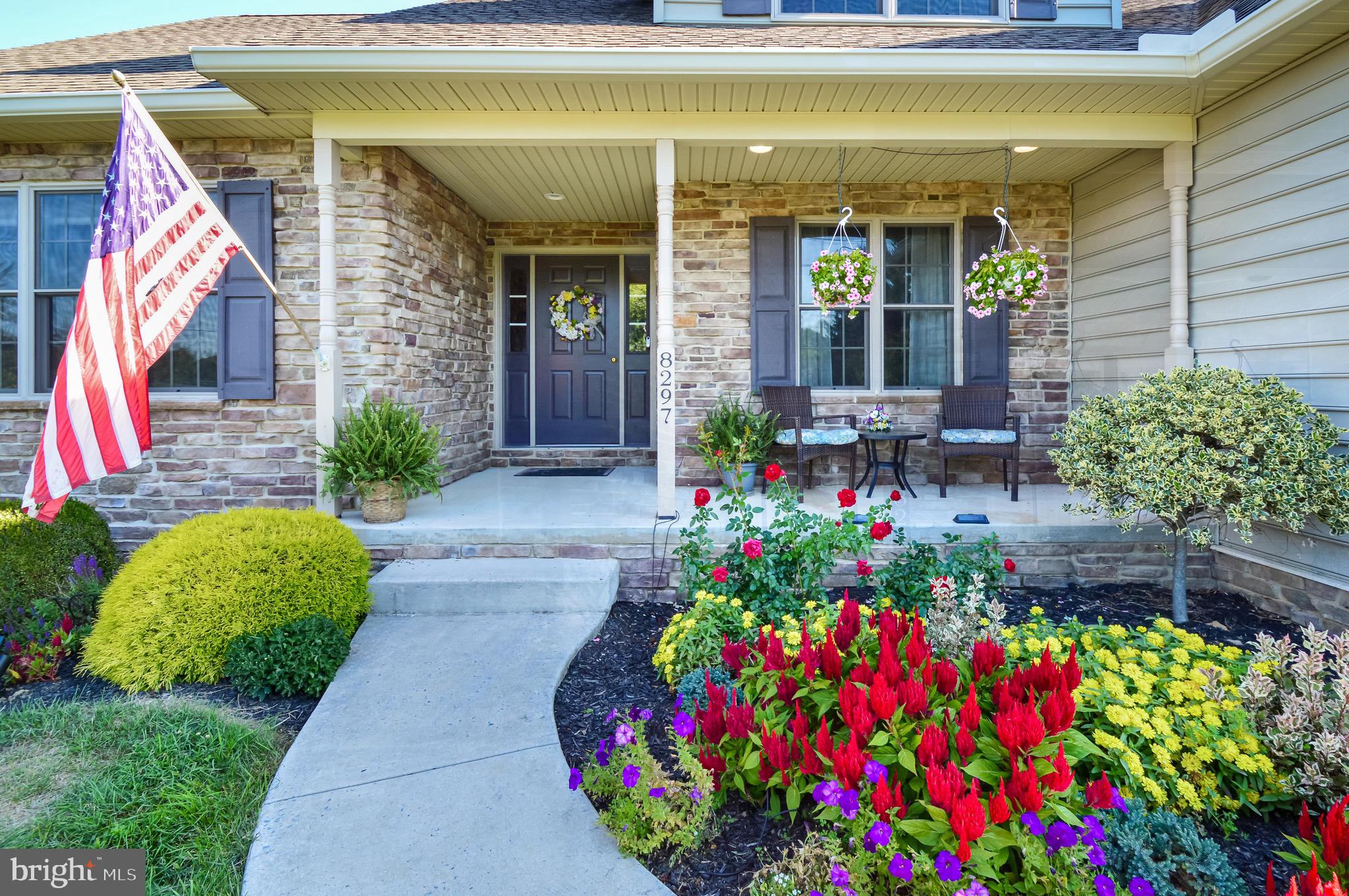 8297 Stottlemyer Road Waynesboro, PA 17268 - Photo 38 of 51 a front view of a house with a flower garden