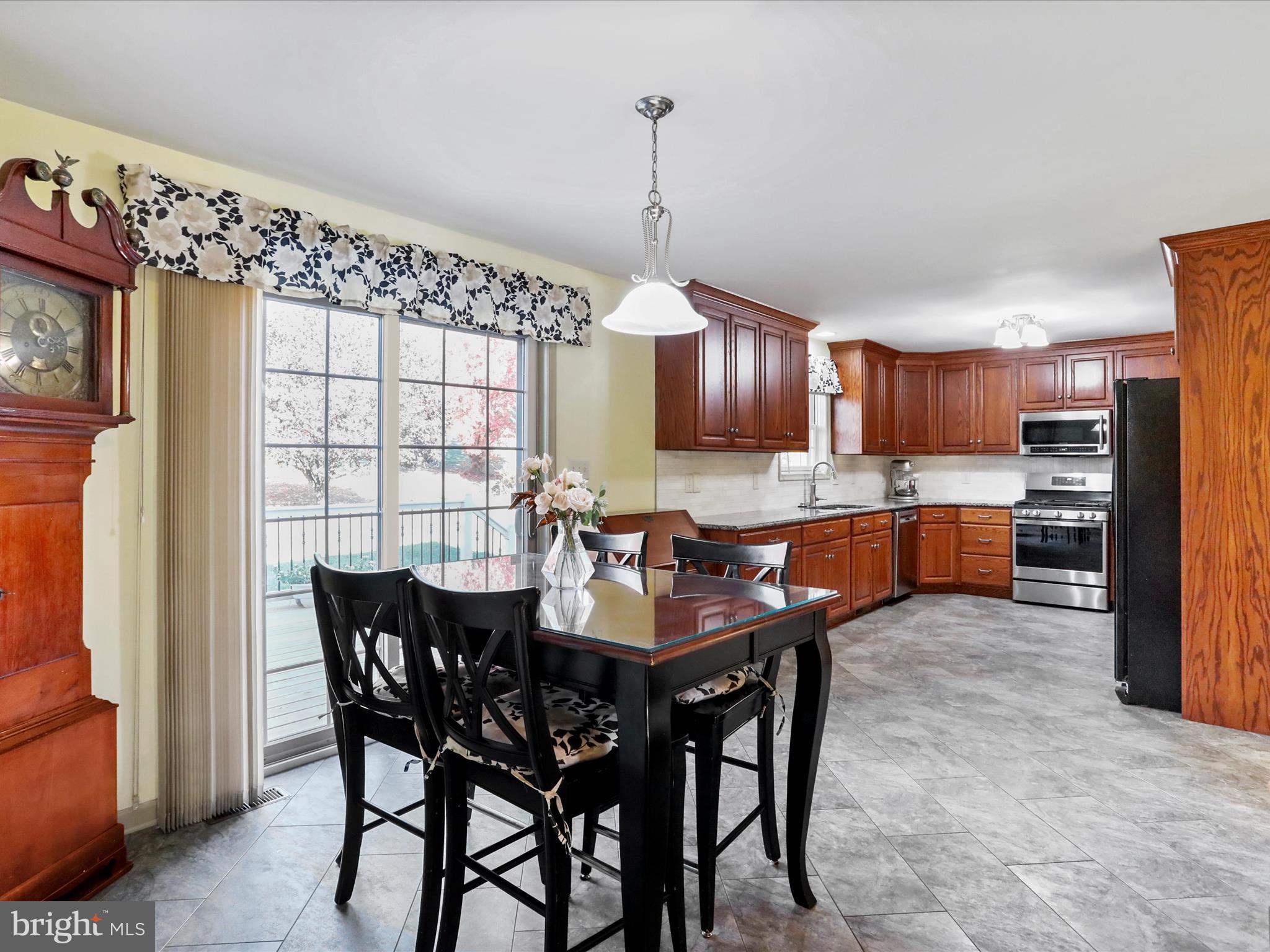 8297 Stottlemyer Road Waynesboro, PA 17268 - Photo 9 of 51 a view of a dining room with furniture window and wooden floor