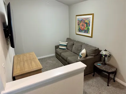 a living room with furniture and a couch