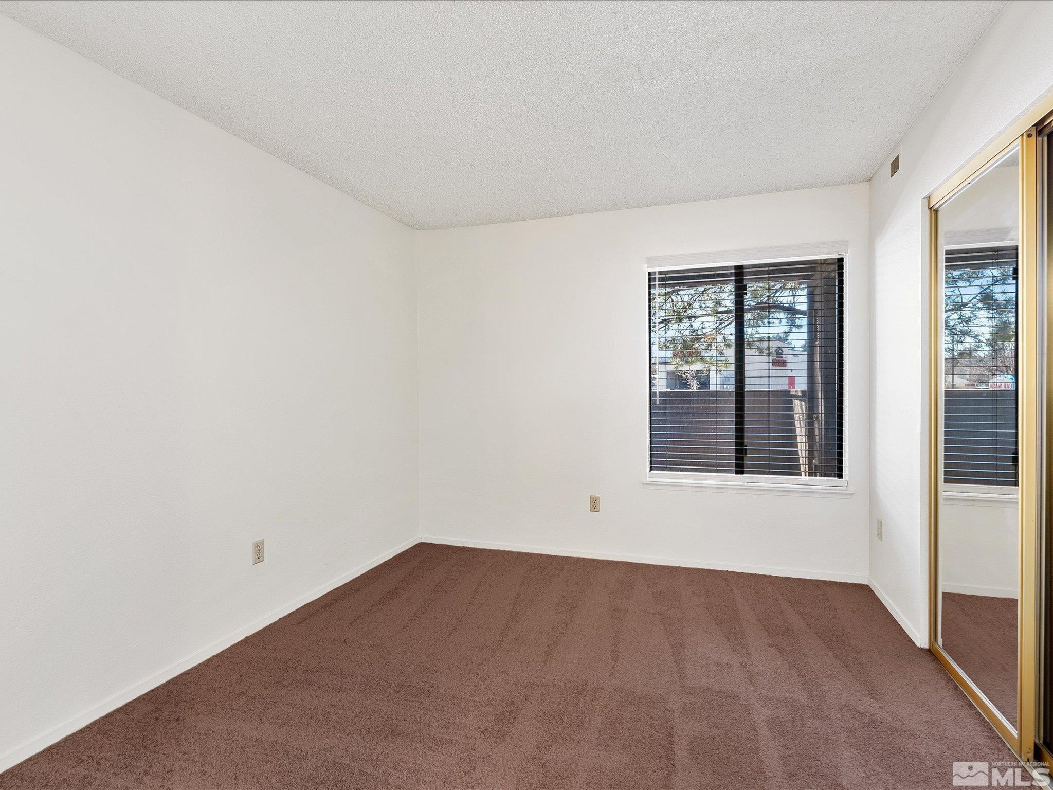 1465 East Peckham Lane, Unit 55 Reno, NV 89502 - Photo 12 of 22 an empty room with a window