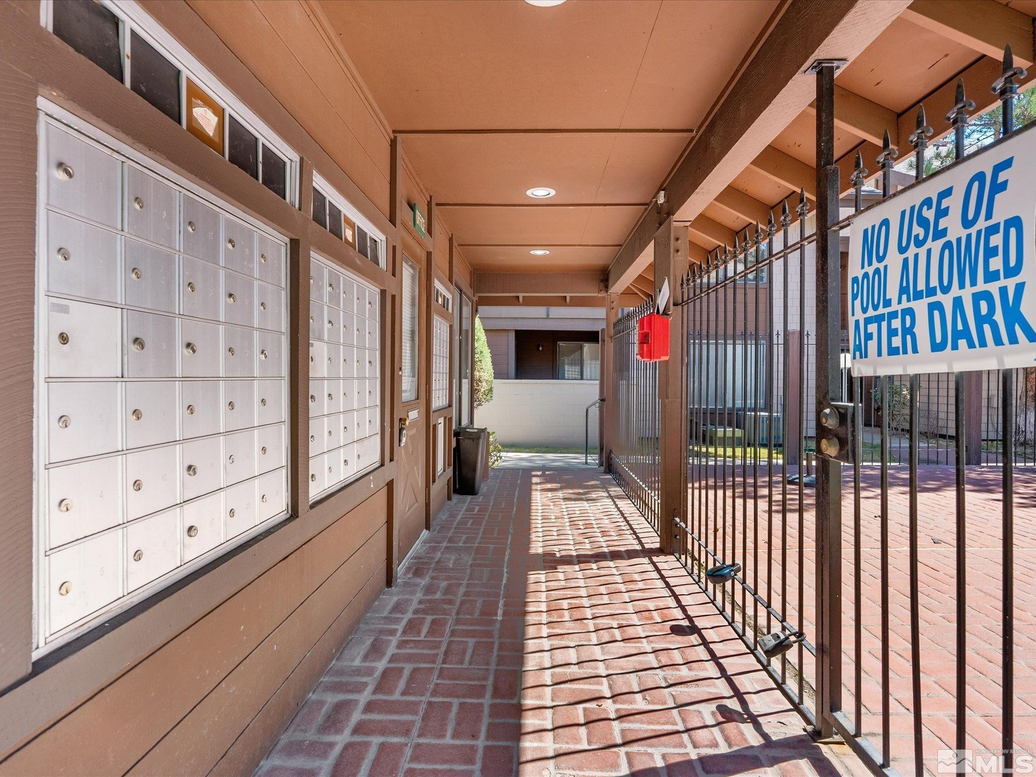 1465 East Peckham Lane, Unit 55 Reno, NV 89502 - Photo 20 of 22 a view of a pathway along a building
