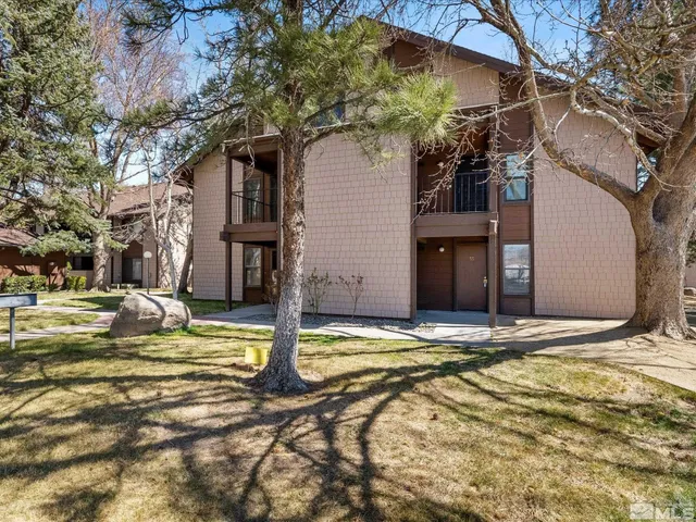 a view of a house with snow on the tree