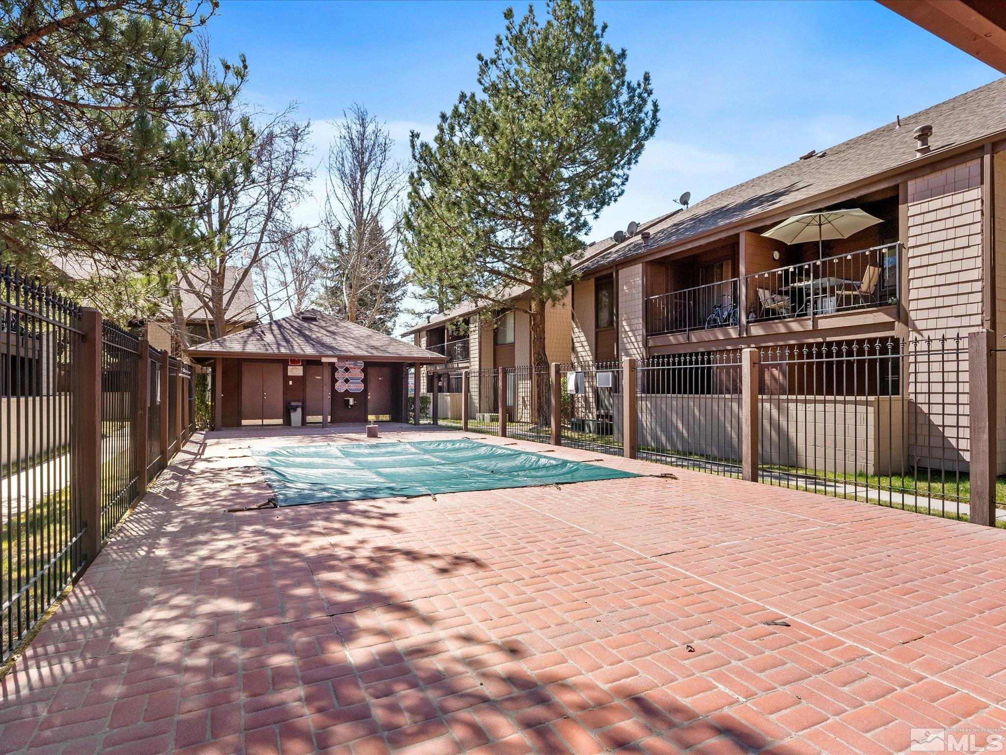 1465 East Peckham Lane, Unit 55 Reno, NV 89502 - Photo 21 of 22 a view of a house with a yard