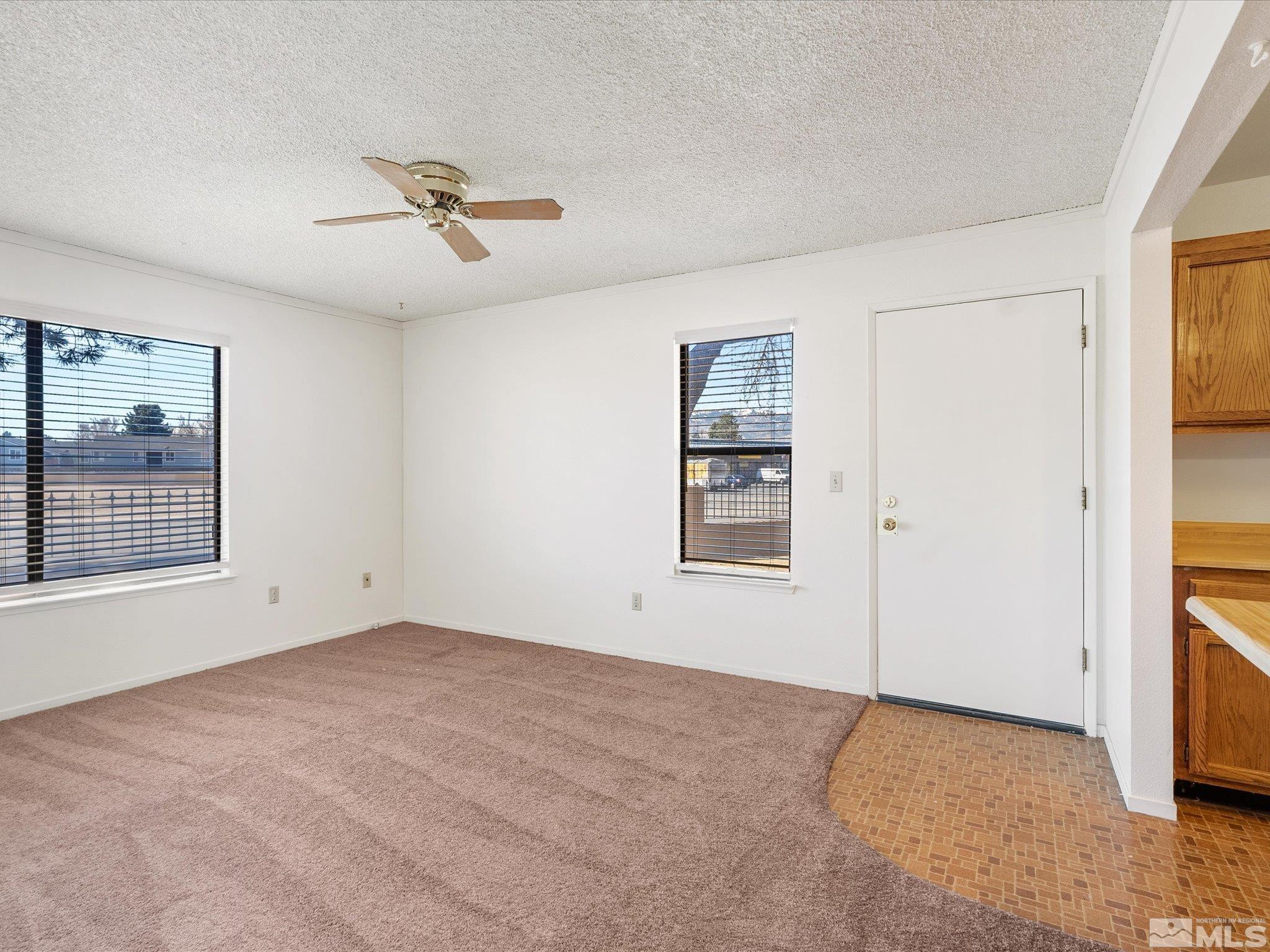 1465 East Peckham Lane, Unit 55 Reno, NV 89502 - Photo 7 of 22 a view of an empty room with a window