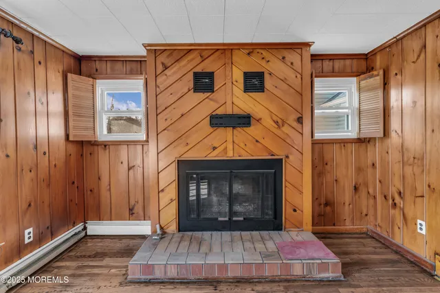 a living room with a fireplace furniture and a window