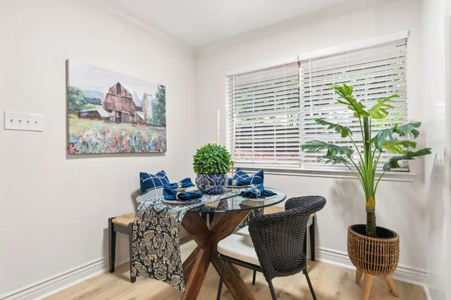 a dining room with furniture and windows