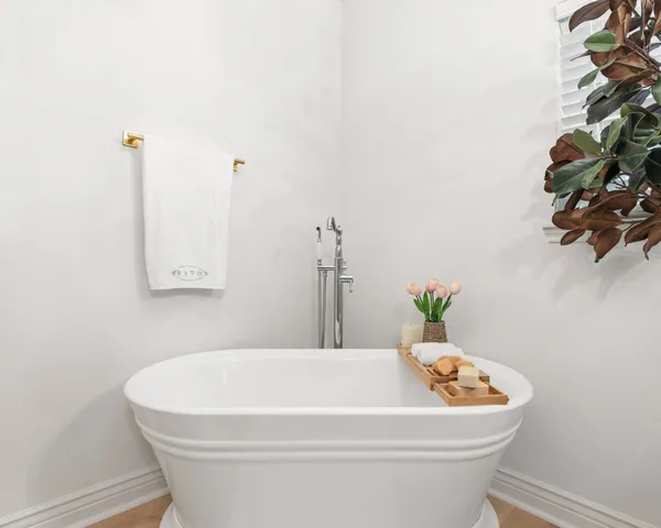 a white bath tub sitting in a bathroom