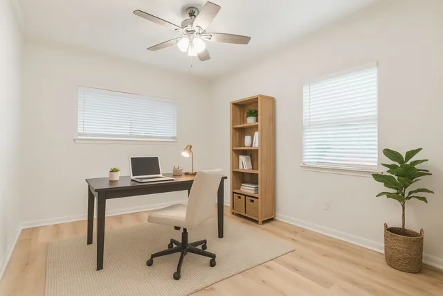 a view of a workspace with furniture