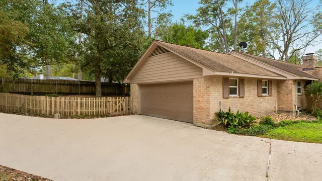 a view of backyard with a garden and trees