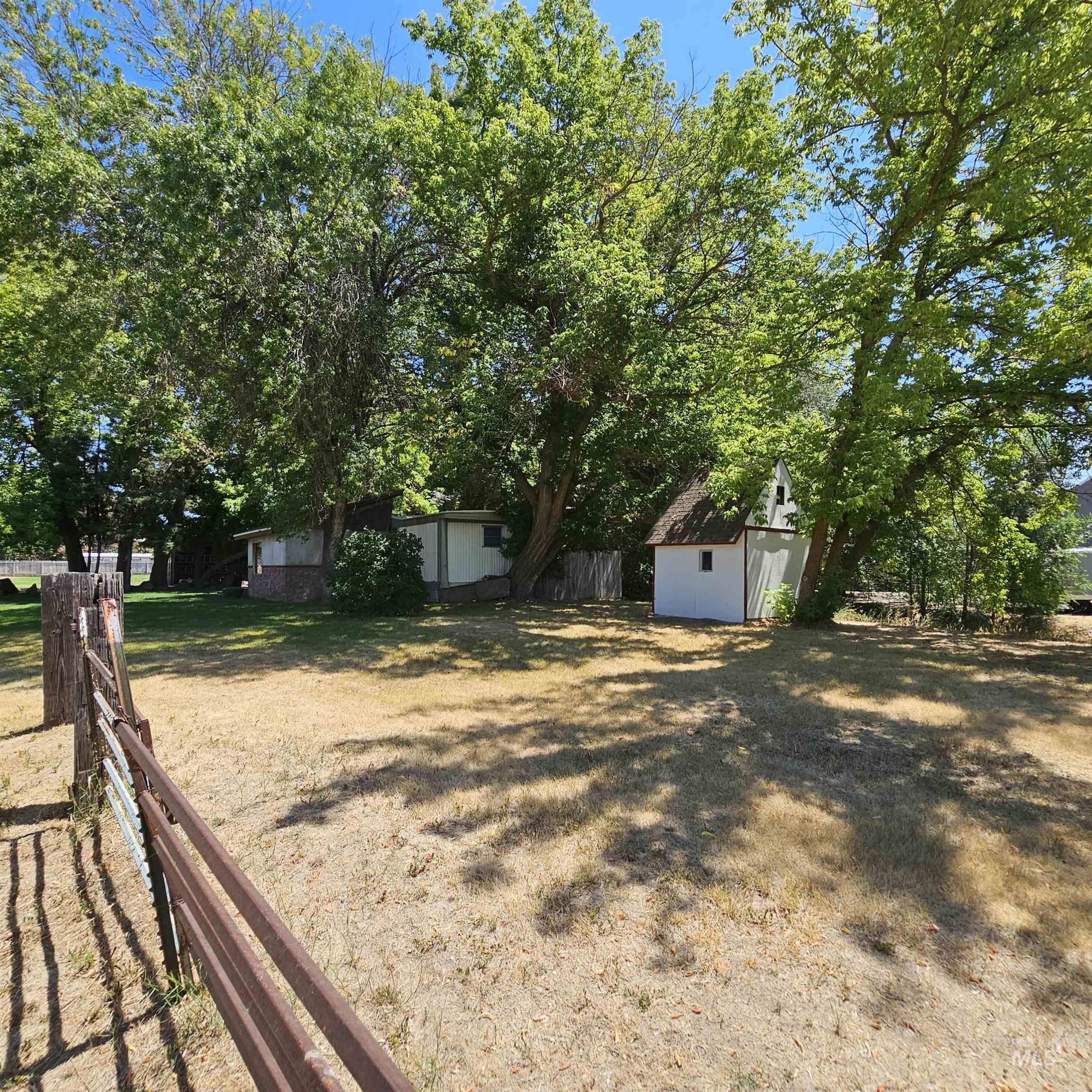 2141 East Syringa Street Eagle, ID 83616 - Photo 19 of 26 View of yard with a storage unit